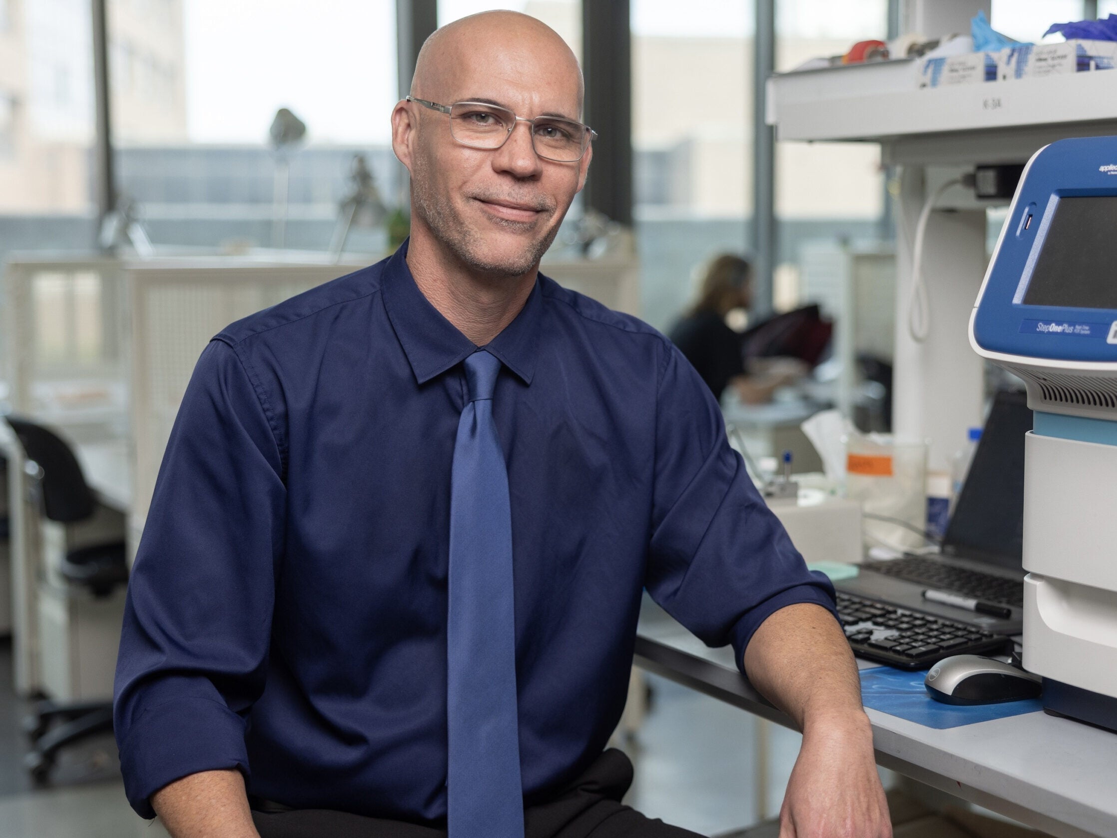 Dr. Mark Mondrinos sitting in the research lab at Tulane